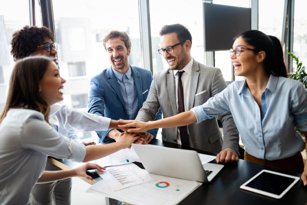 Business team celebrating a good job in the office