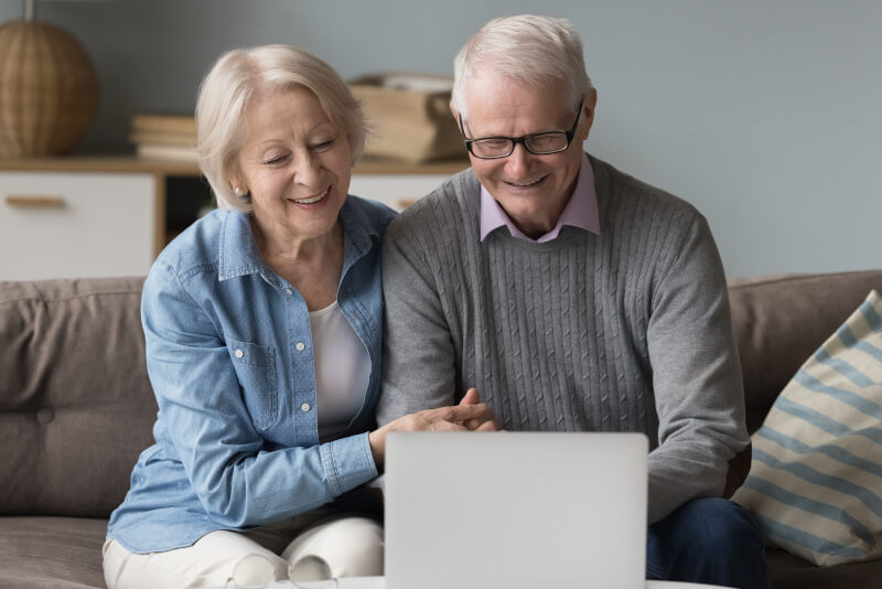 Cheerful senior using retail banking customer service platform